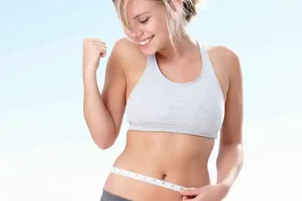 woman happy after fat reduction treatment Glossop