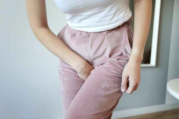 woman running for the toilet because of urinary incontinence Glossop